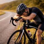 Cyclist resting after a bike ride while feeling nauseous and exhausted
