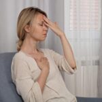 Person feeling dizzy during deep breathing exercise