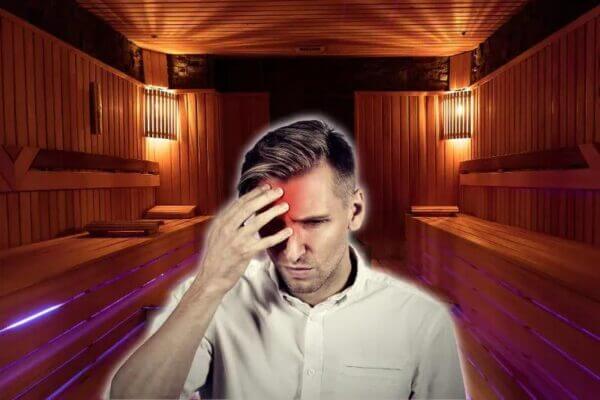 Person recovering from sauna headache with water and towel