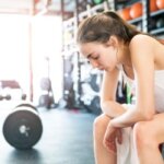 Person feeling tired after exercise without muscle soreness