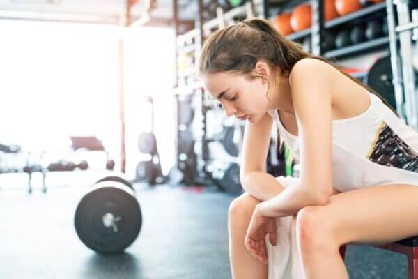 Person feeling tired after exercise without muscle soreness