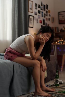 Person feeling anxious the morning after drinking alcohol