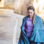 Person feeling cold after exercise while cooling down after a sweaty workout