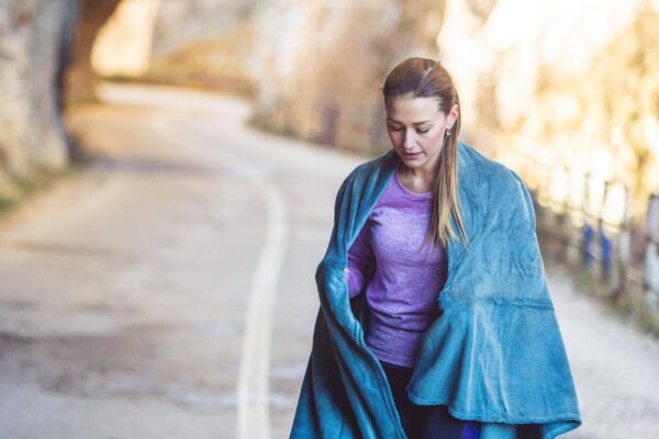Person feeling cold after exercise while cooling down after a sweaty workout