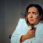 Person feeling cold after getting out of a hot shower