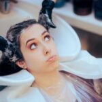 Woman feeling dizzy after getting a haircut at a salon