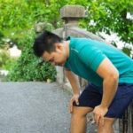 Person feeling dizzy after a long walk in warm weather