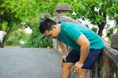 Person feeling dizzy after a long walk in warm weather