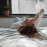 Person feeling exhausted after crying in a quiet room