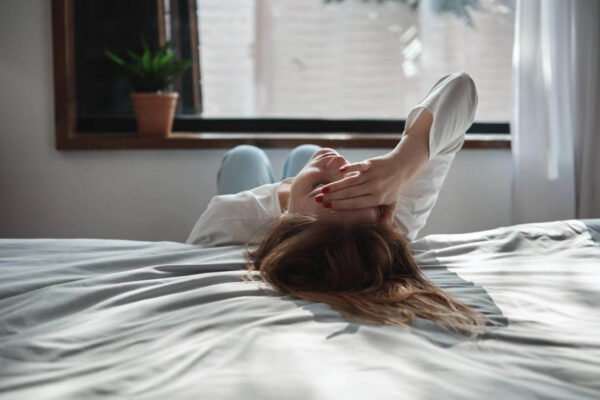 Person feeling exhausted after crying in a quiet room