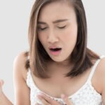 Person feeling nauseous after drinking green tea