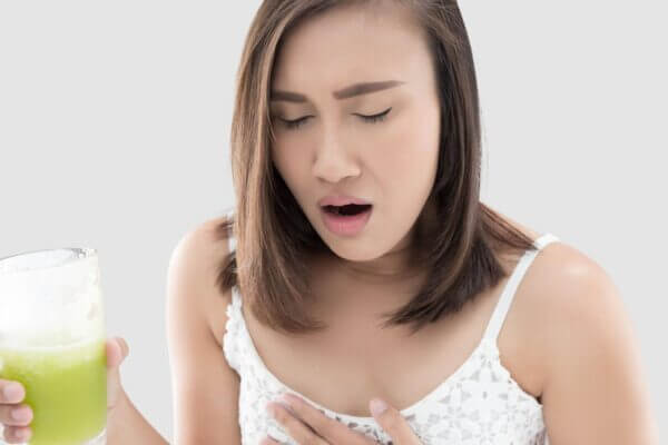 Person feeling nauseous after drinking green tea