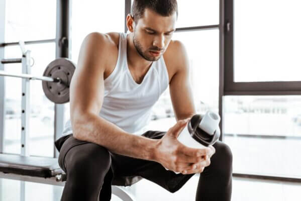 Person feeling nauseous after drinking a protein shake after workout