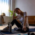 Person feeling nauseous and dizzy during deep stretching routine