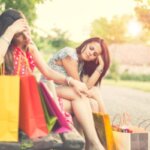 Person feeling overstimulated after grocery shopping and resting quietly in a car