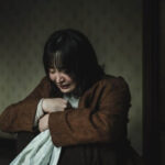 Person calming down after crying while feeling shaky and emotionally drained