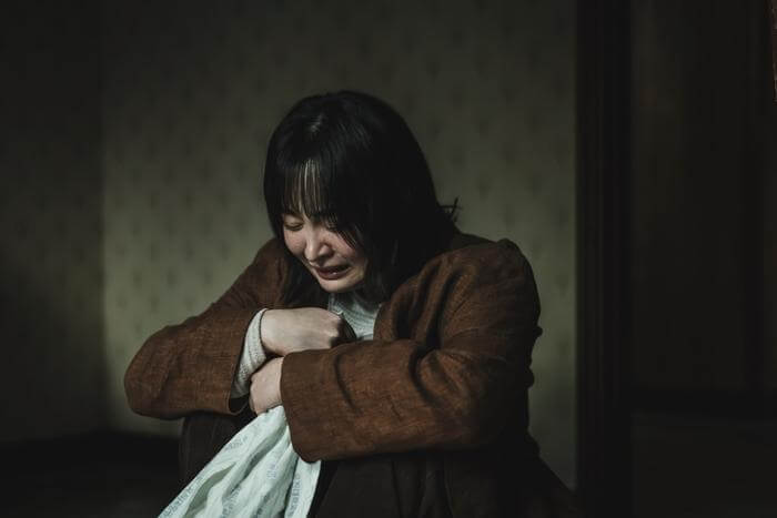 Person calming down after crying while feeling shaky and emotionally drained