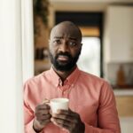 Person feeling shaky and uneasy after drinking tea