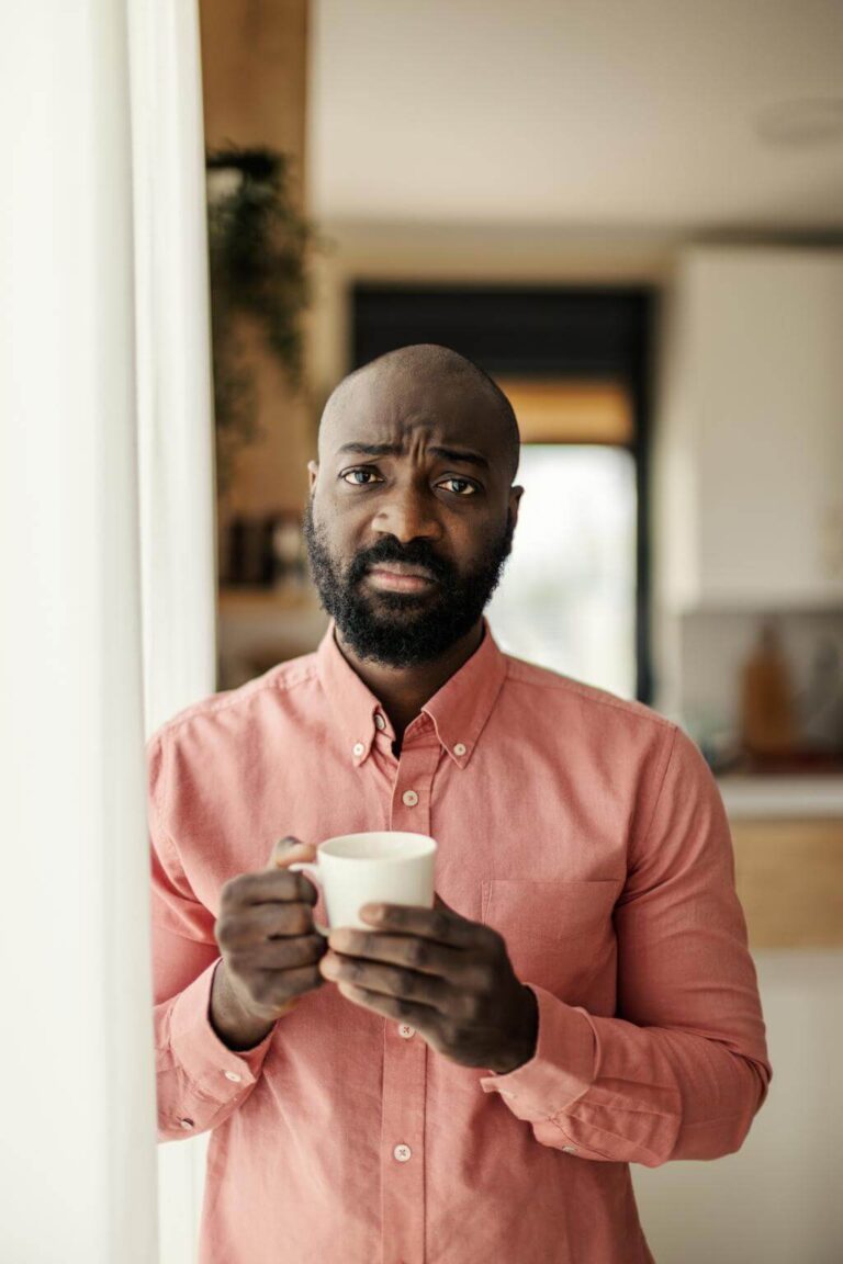 Person feeling shaky and uneasy after drinking tea