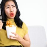 Person feeling shaky after eating spicy food