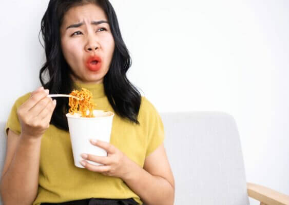 Person feeling shaky after eating spicy food