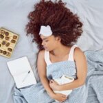 Person feeling nauseous after eating chocolate at home