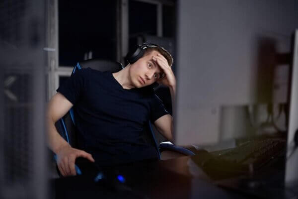 Person feeling nauseous while playing a fast first-person video game