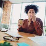 Person feeling tired after drinking coffee instead of energized