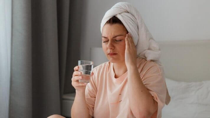 Person feeling faint after standing up from a hot bath
