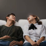 Person catching breath and feeling weak after intense laughter