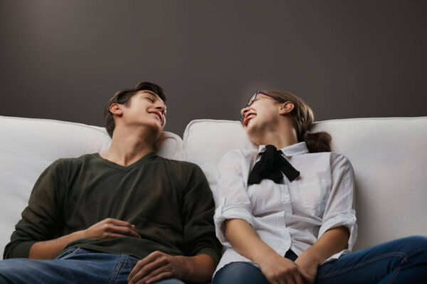 Person catching breath and feeling weak after intense laughter