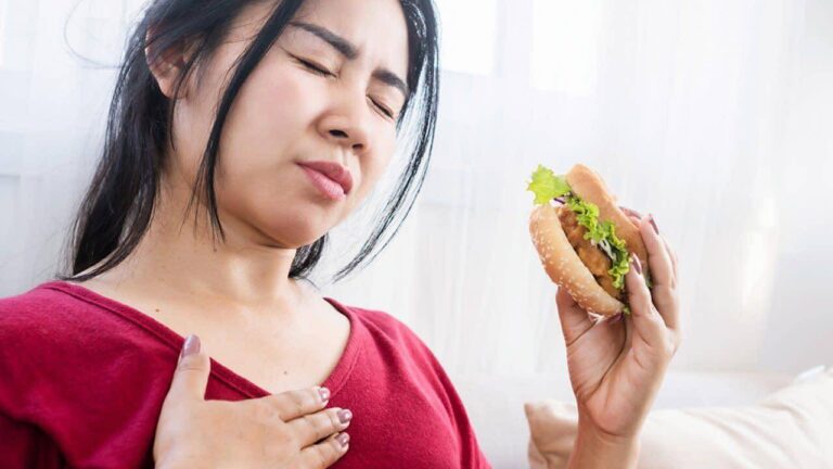 Person feeling heart racing and uneasy after eating a meal