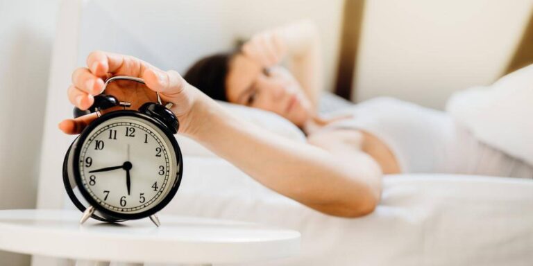 Groggy morning feeling after oversleeping and waking up tired