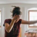 Person feeling lightheaded and shaky after constipation