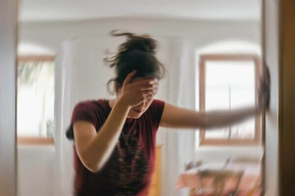 Person feeling lightheaded and shaky after constipation