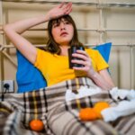 Person feeling lightheaded after drinking tea at home