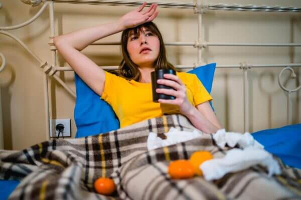 Person feeling lightheaded after drinking tea at home