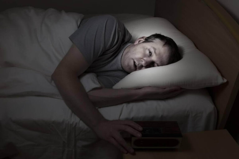 “Person awake in bed after 5 hours of sleep and unable to fall back asleep