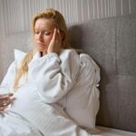Person waking up with dry mouth and morning headache