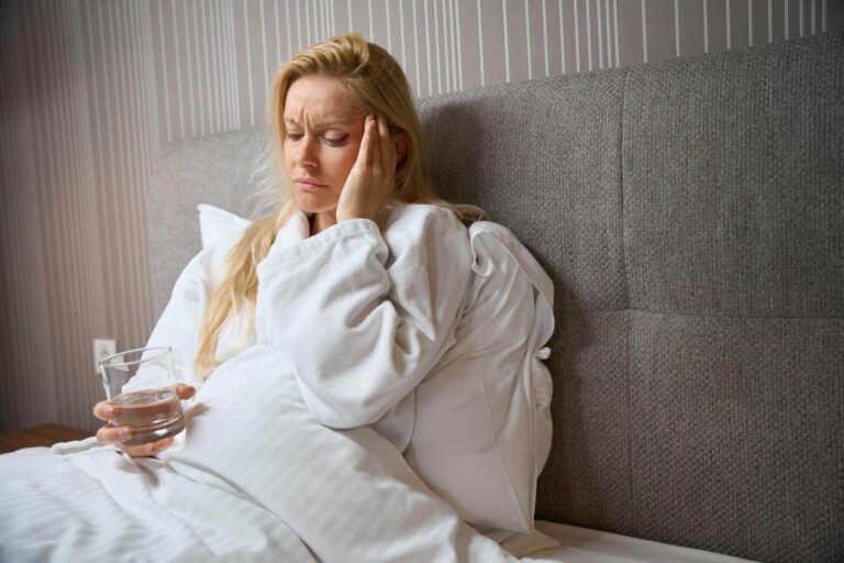 Person waking up with dry mouth and morning headache