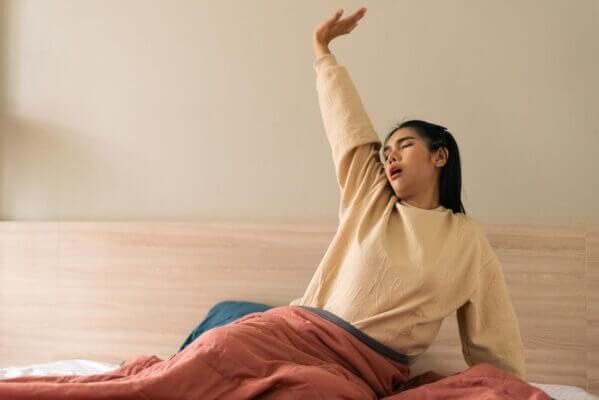 Person feeling lightheaded after yawning and stretching