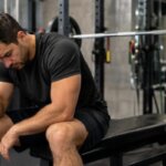 Man resting after bench press with head pressure and headache symptoms