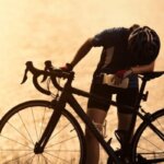 Cyclist recovering after a ride and feeling physically weak