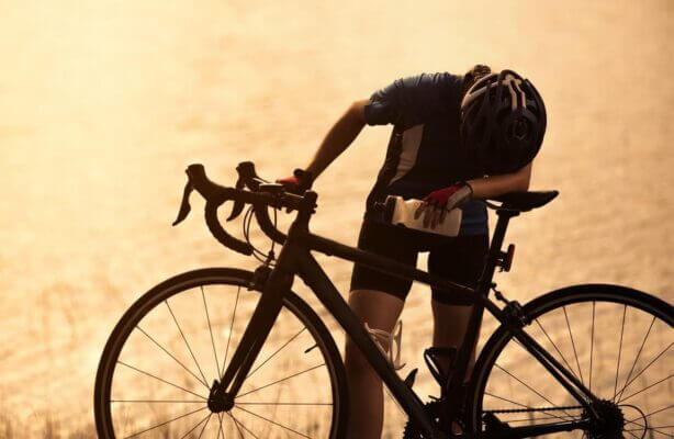 Cyclist recovering after a ride and feeling physically weak
