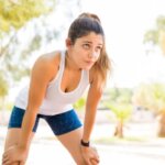 Runner feeling weak and exhausted after running in a park