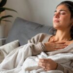 Woman calming down after crying with hand on chest