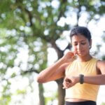 Runner checking a fast heartbeat after a run
