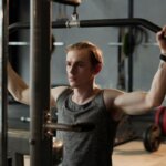 Athlete performing a cable pulldown exercise during a strength workout