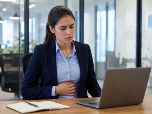 Professional preparing for a meeting while experiencing mild nausea and nervous anticipation